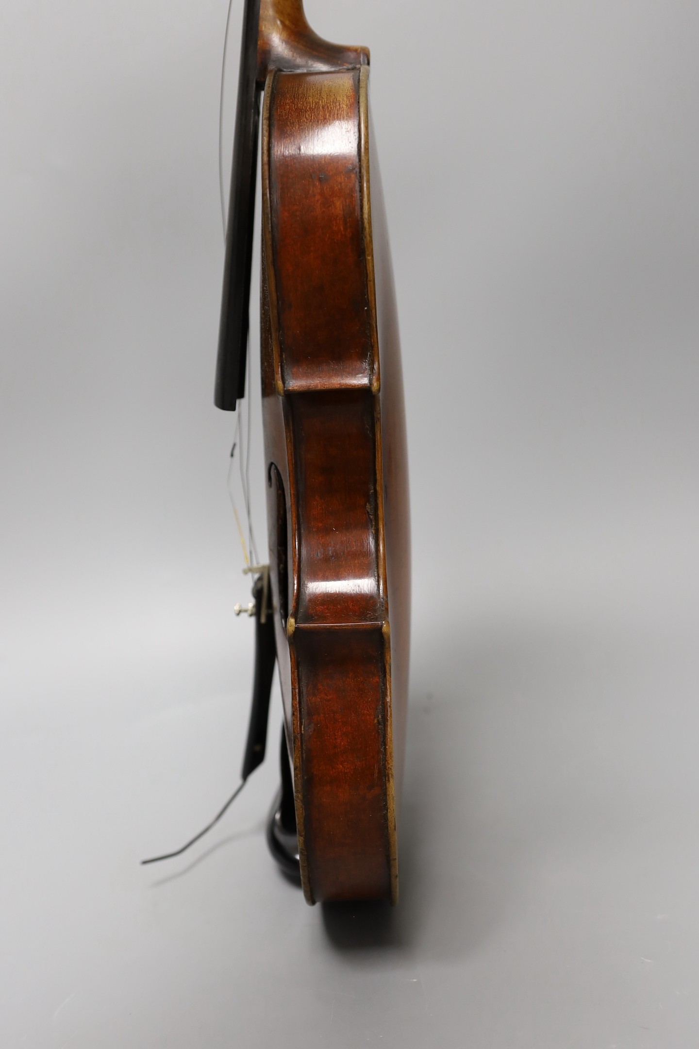 A violin labelled 'Albani Palermo', cased, length of back 35.5cm